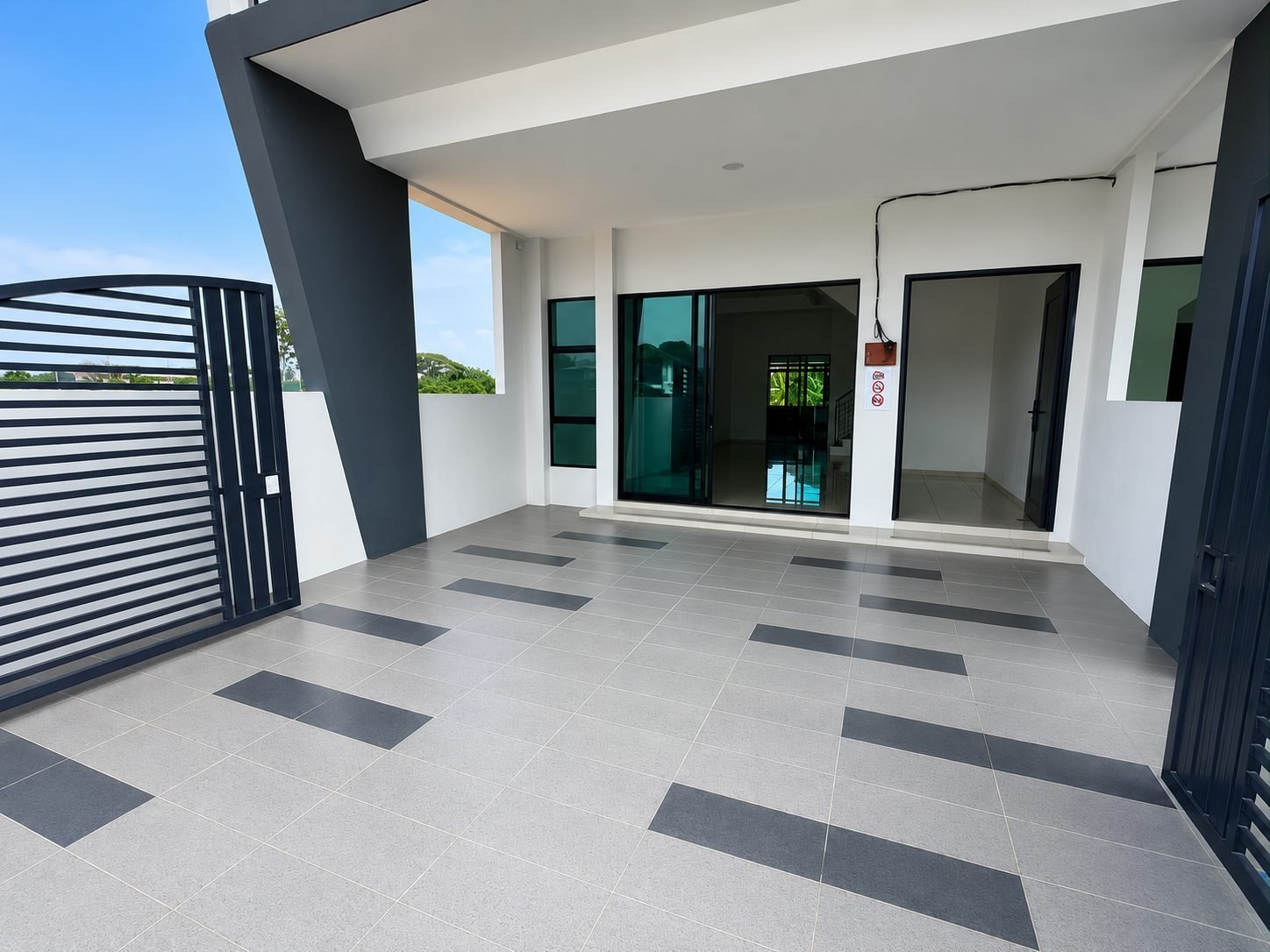 Car porch beneath the balcony at the Ampang Cove terrace show house