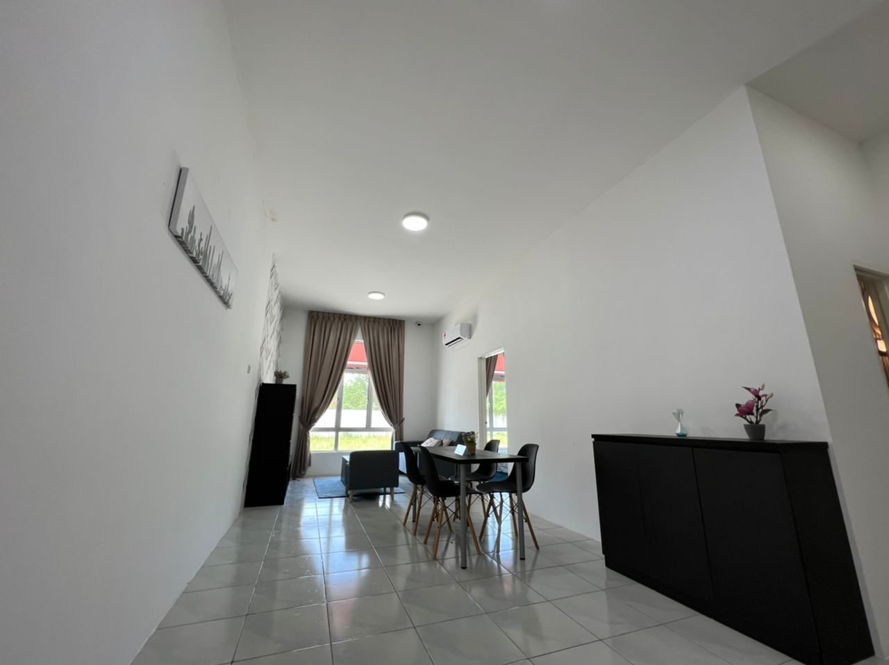 Living and dining area of the 1-bedroom show unit