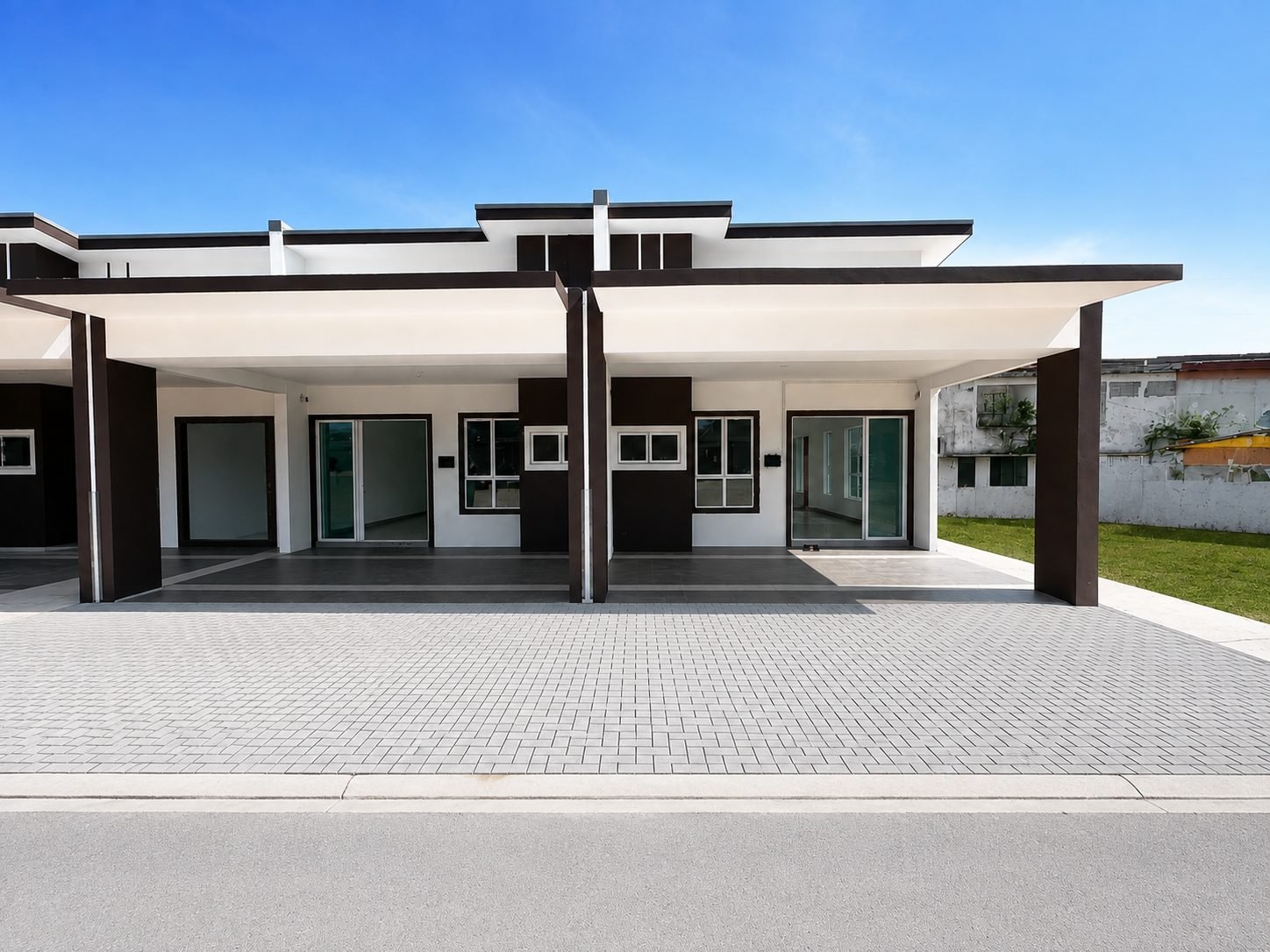Front elevation and covered car porch of a completed single-storey terrace at Arena Perpaduan Utama, Tambun, Ipoh