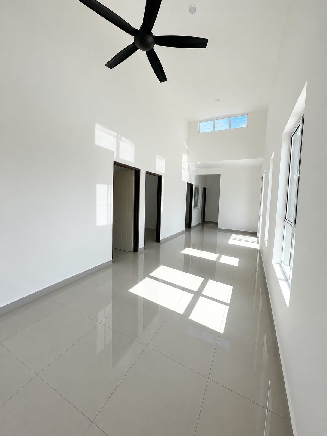 Living and dining under a raked ceiling with a clerestory window band, Arena Perpaduan Utama