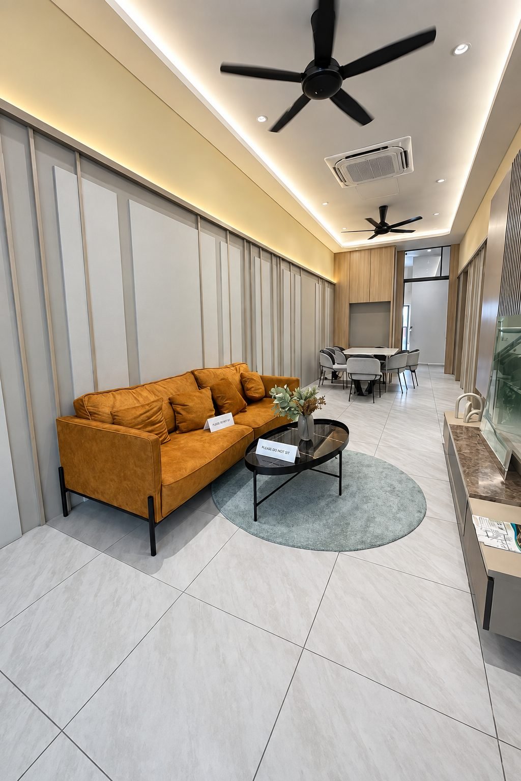 Living area with cove lighting and a fluted feature wall, Taman Gopeng Mewah show house
