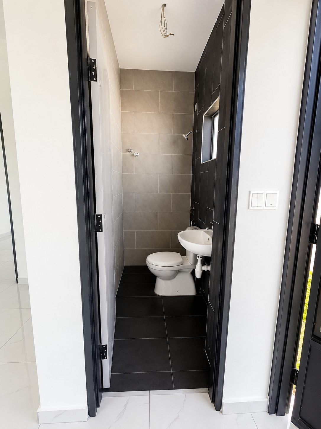 Bathroom finished in dark tile, Taman Klebang Ria Type B