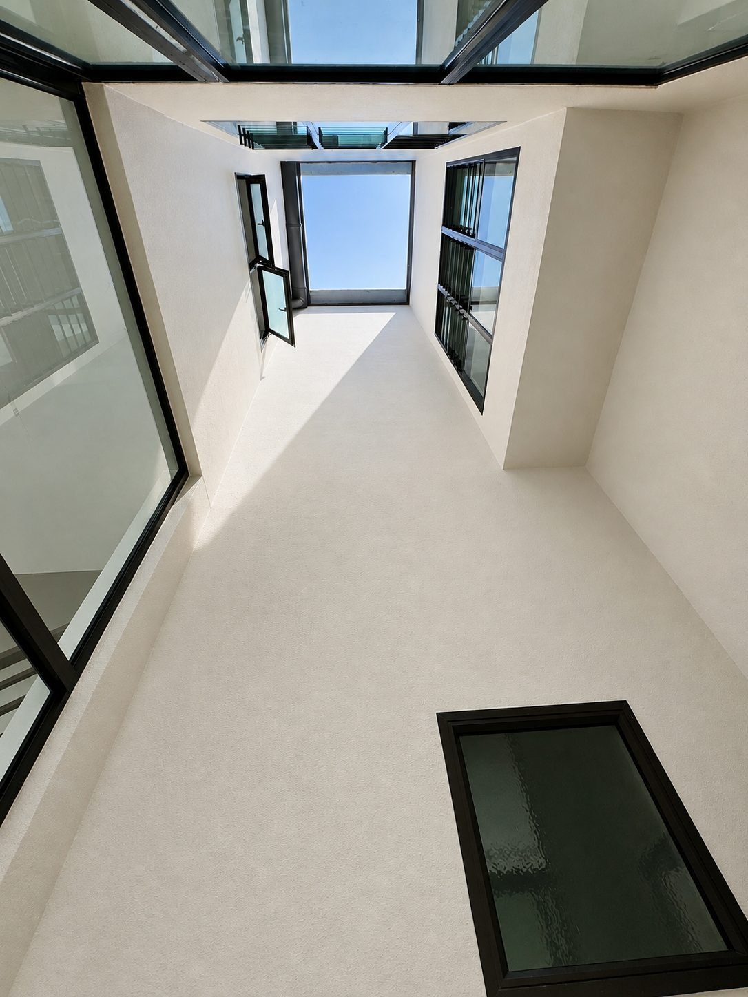 Double-height air well with skylight glazing at the Taman Lapangan Indah show house