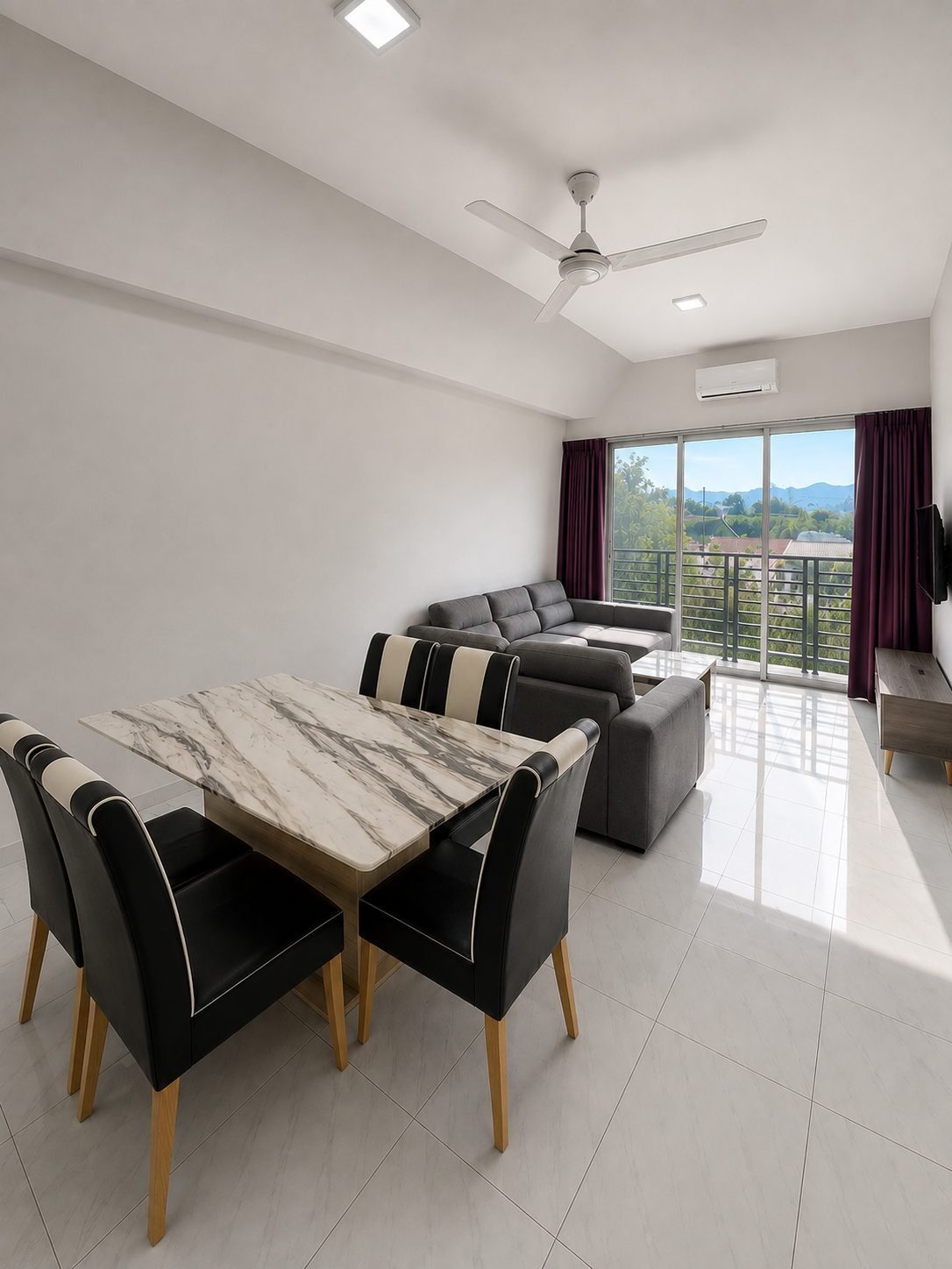 Dining and living area of the furnished 872 sq ft Type A, Pangsapuri Putra Bercham
