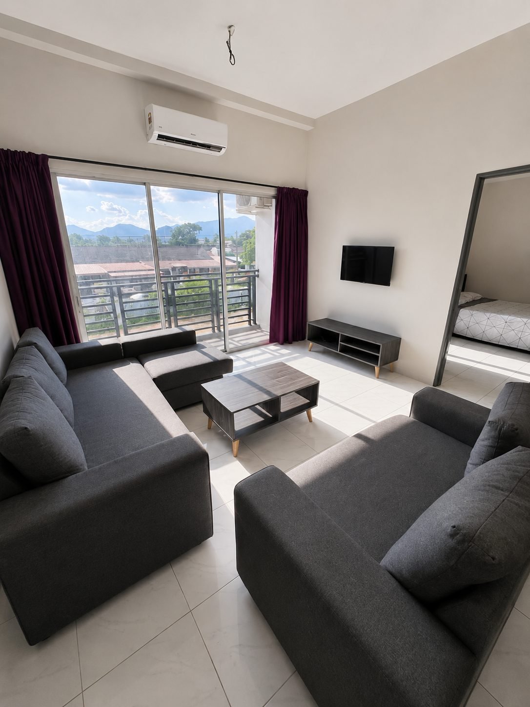 Living area with the balcony and hill view beyond, Type A show unit, Pangsapuri Putra Bercham