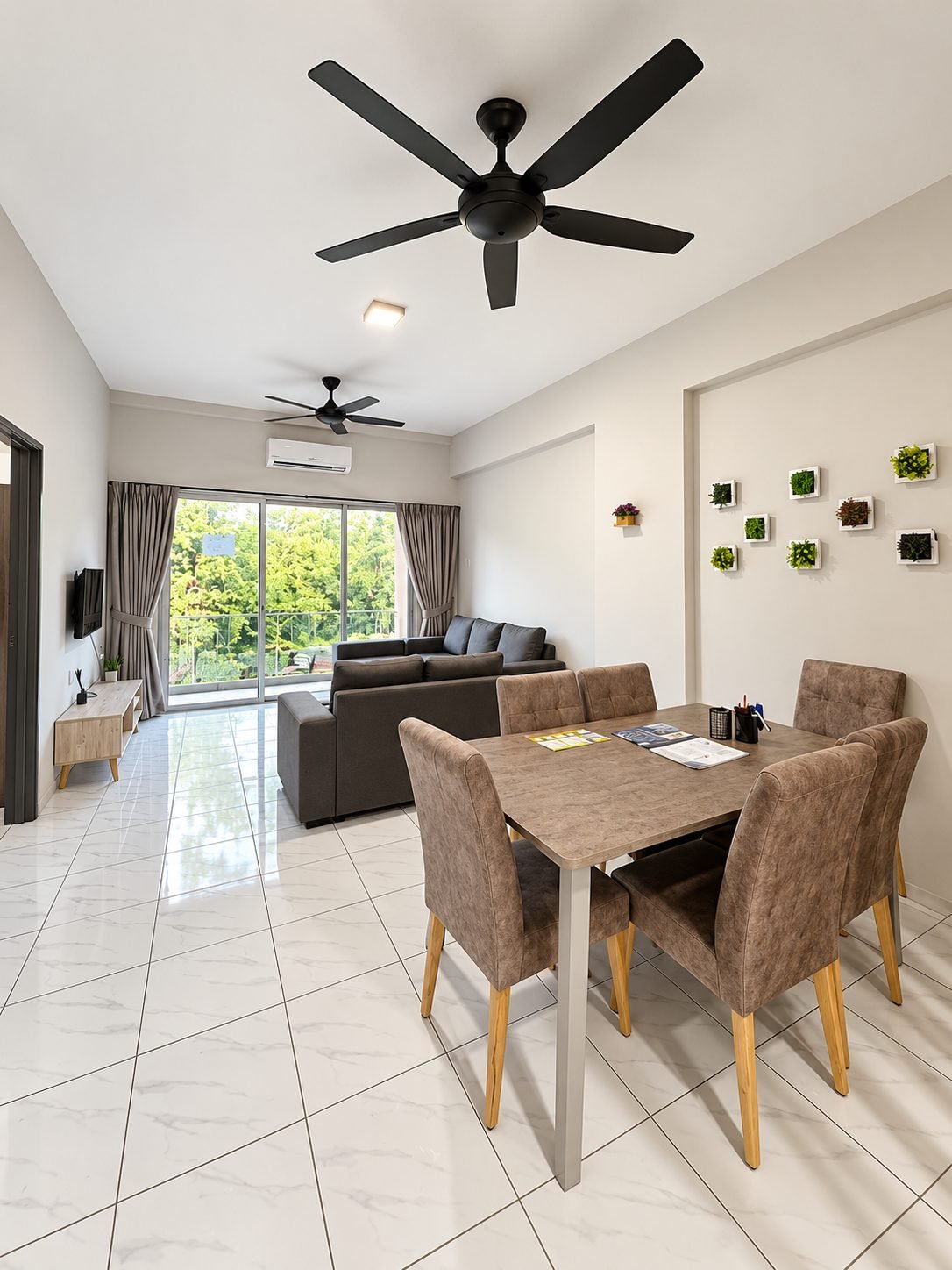 Dining and living area of the furnished 980 sq ft Type C2, Pangsapuri Putra Bercham
