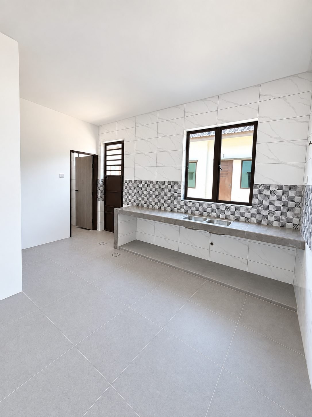 Fitted kitchen counter and tiled splashback, double-storey show house