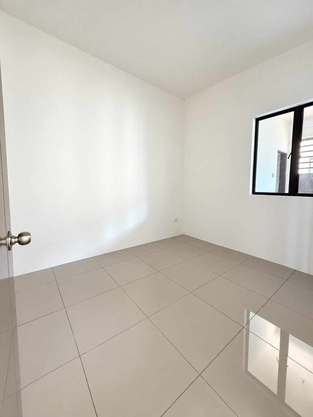Unfurnished ground-floor bedroom with a window, double-storey show house