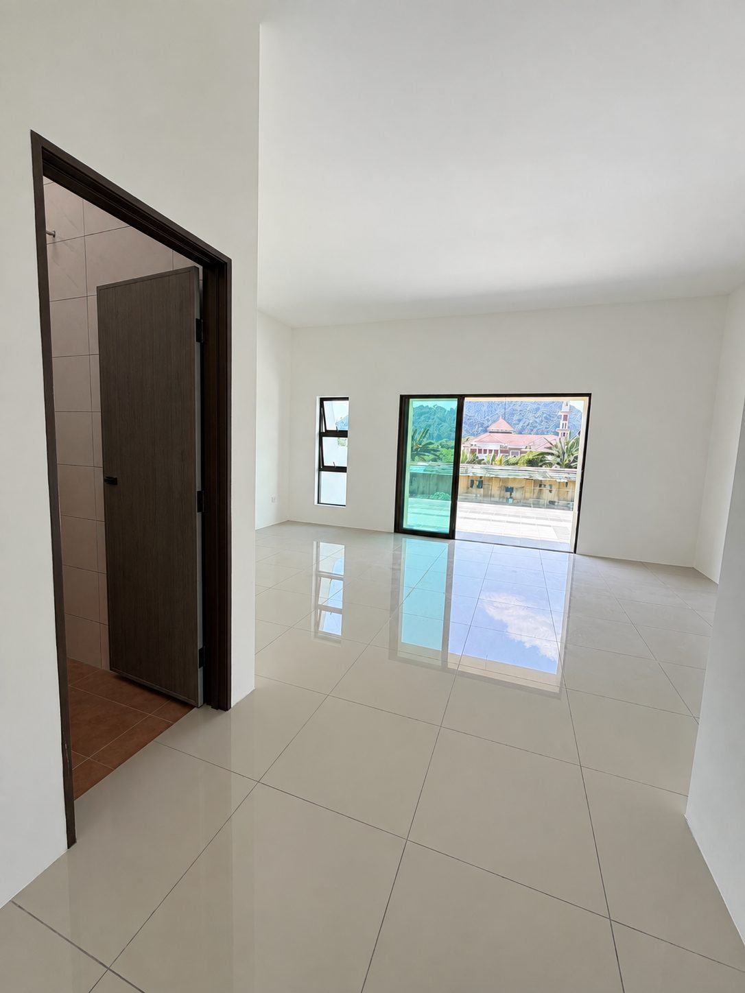 Unfurnished upstairs bedroom with the balcony door and a view out, double-storey show house