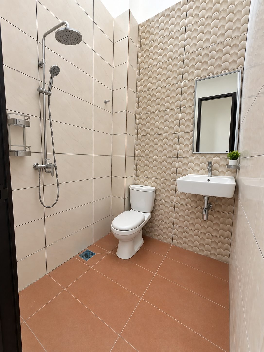 Fitted bathroom with a terracotta floor and a walk-in shower, single-storey show house