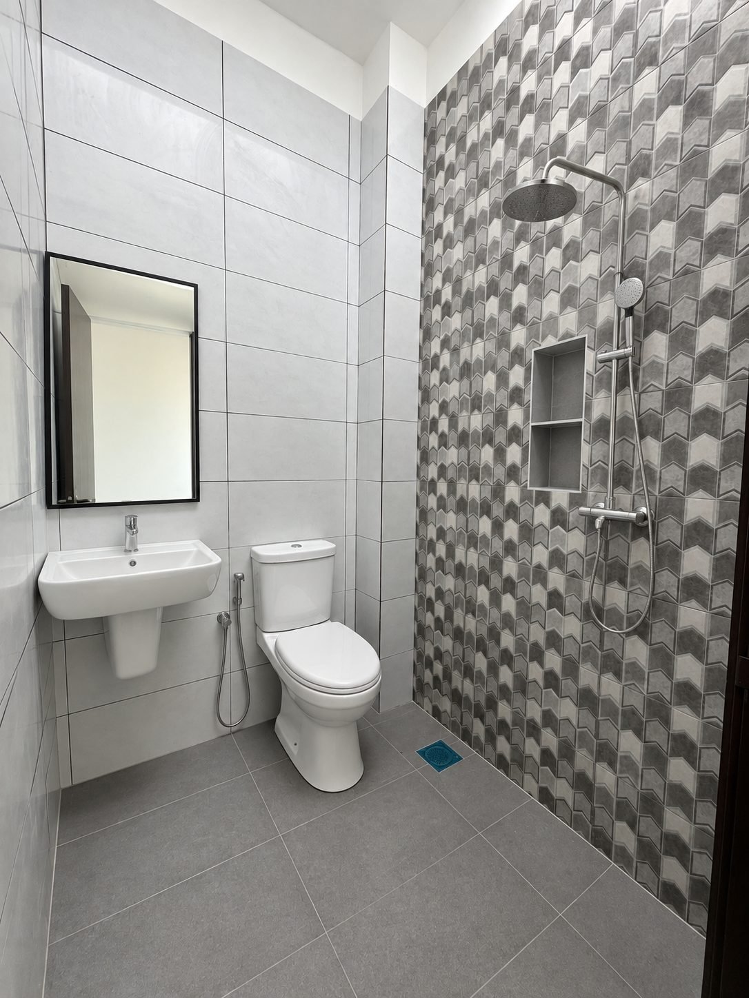 Second fitted bathroom with grey feature tiling, single-storey show house
