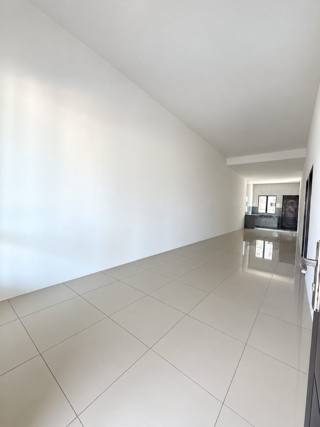 Unfurnished living area looking down the length of the single-storey show house