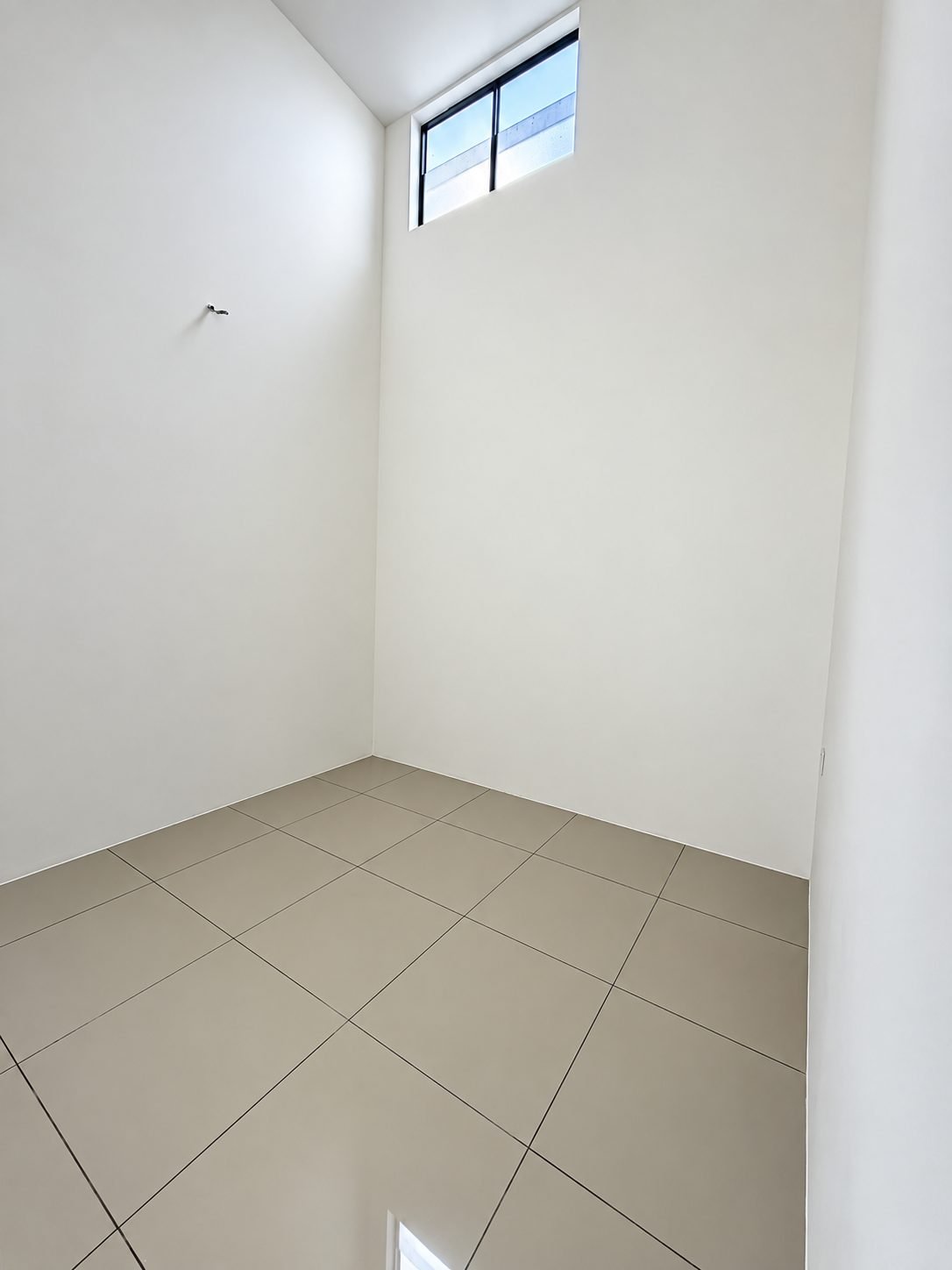 Unfurnished bedroom with a high window, single-storey show house