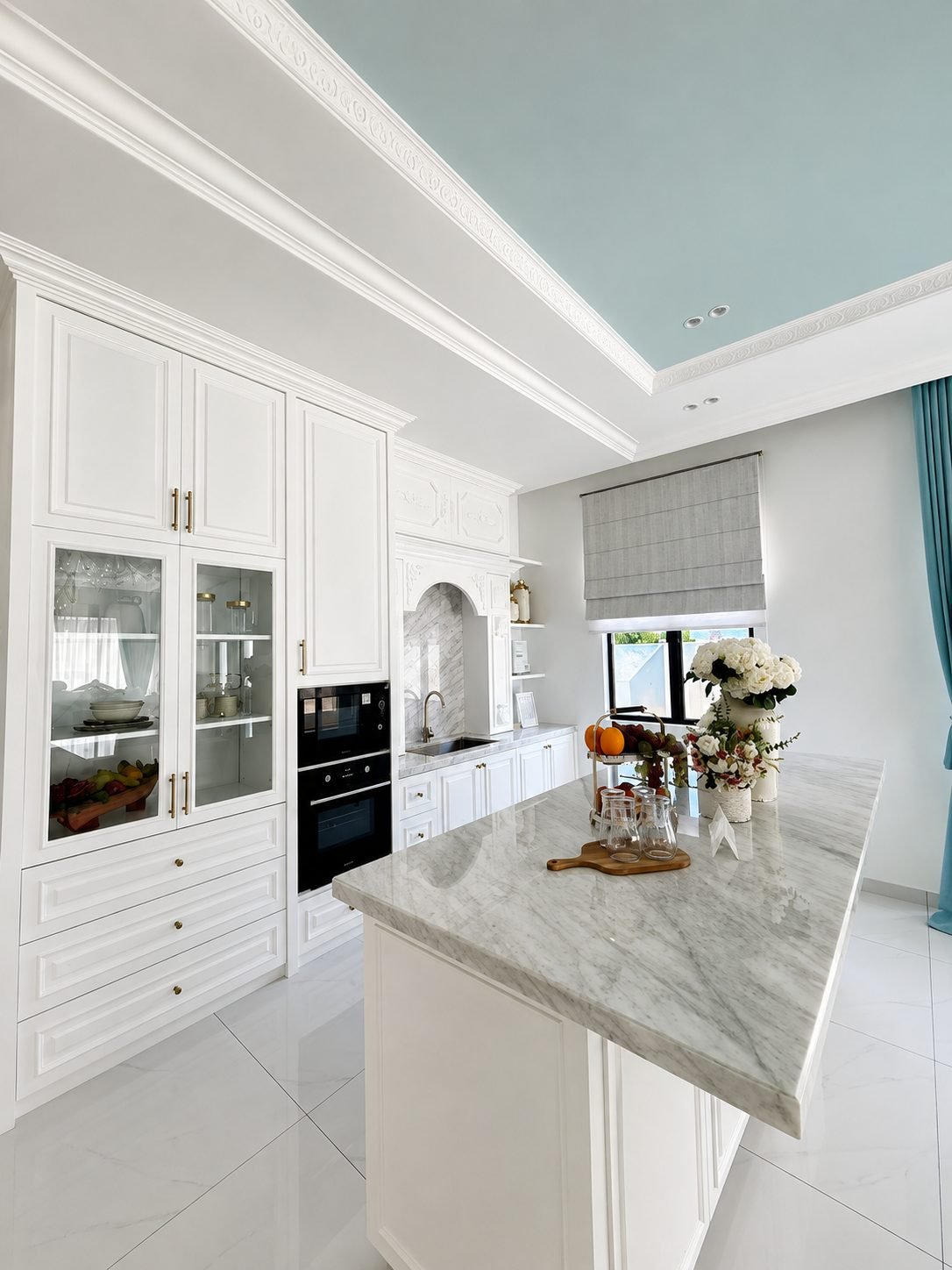 Kitchen with classical cabinetry and a marble island, Thompson Prestige show house