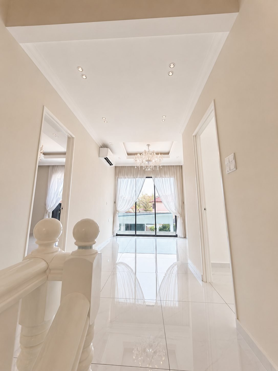 First-floor landing with a balustrade and chandelier, Thompson Prestige